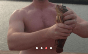 shirtless man choking a fish